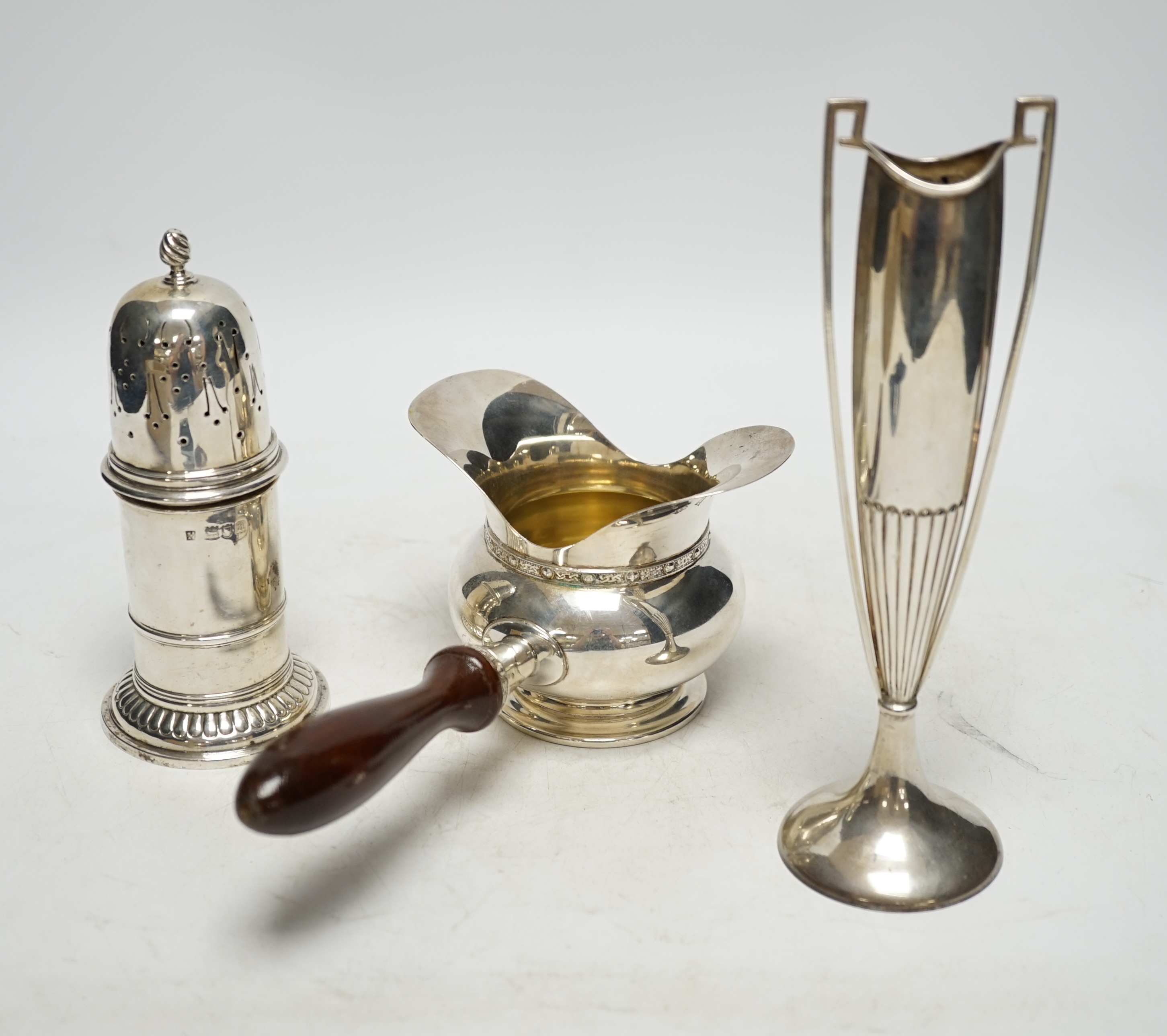 An Art Nouveau silver two handled posy vase, Birmingham, 1912, 19.9cm, a Victorian silver sugar caster and a modern silver double lipped pan. Condition - fair